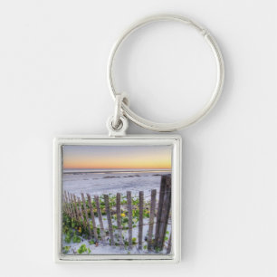 Llavero Una cerca de la playa en la puesta del sol
