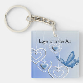 Llavero Una mariposa y corazones