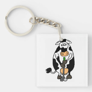 Llavero Una vaca jugando al golf