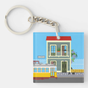 Llavero Vieja casa de Lisboa con gatos y tranvía amarillo