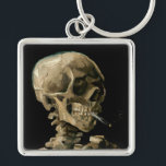 Llavero Vincent van Gogh - Calavera con cigarrillo en llam<br><div class="desc">Cabeza de un Skeleton con un cigarrillo en llamas / Calavera con cigarrillo en llamas / Crane de squelette fumant une cigarrillo - Vincent van Gogh,  1885</div>