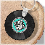 Llavero Vinilo | DJ musical | Código QR<br><div class="desc">Presentamos nuestra cadena de claves QR Code de vinilo de personalizable estilo LP - el accesorio perfecto para el profesional de la música! Esta cadena de claves presenta un elegante disco LP vinílico en azul y gris acuático, junto con un código QR que puede vincularse a su propia música. Con...</div>