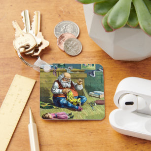 Llavero Vintage Christmas, Santa Claus haciendo muñecas de