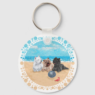 Llavero Westie con Cairn Terriers en la Playa