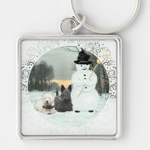 Llavero Westie y Scottie construyen un hombre de nieve