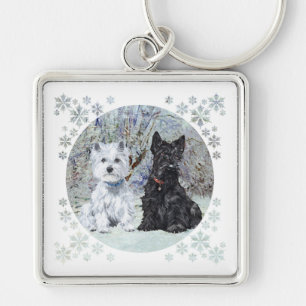 Llavero Westie y Scottie en paisaje nevado