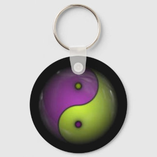 Llavero yin yang púrpura y verde
