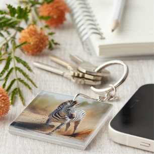 Llavero Zebra en el salvaje y dramático arte de la puesta 