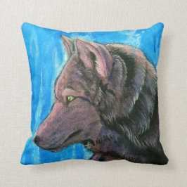 Lobo negro de la fantasía en la almohada azul