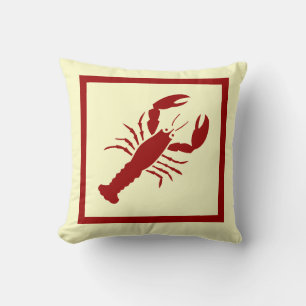LOBSTER rojo sobre almohada blanca