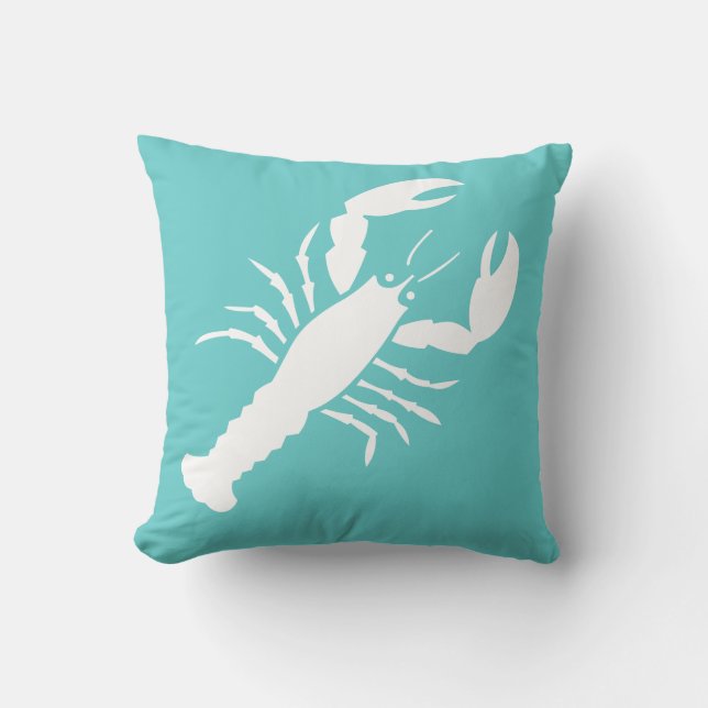 LOBSTER WHITE sobre almohada azul verde azulada (Anverso)