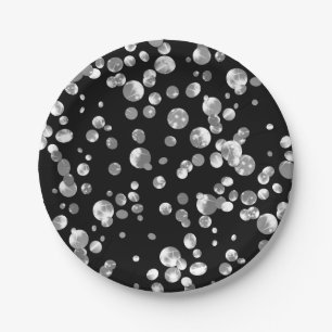 Lunares dorados sobre fondo negro . plato de papel
