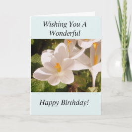 Luz de la flor blanca y tarjeta de cumpleaños de