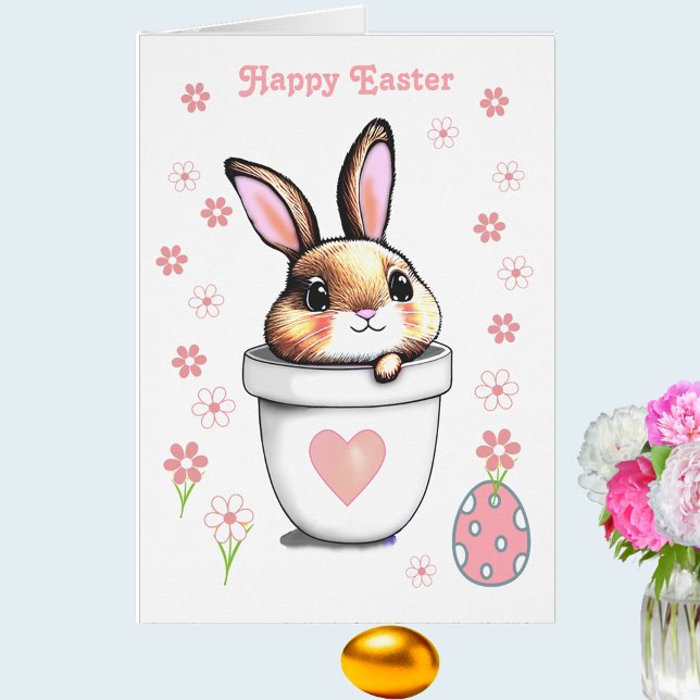 Maceta con conejito de Pascua lindo y flores rosad (Subido por el creador)