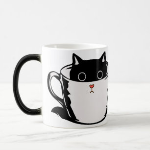 Mágica Gatito negro con nariz roja escondido en una taza