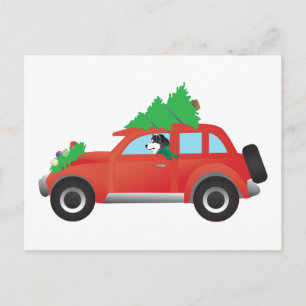 Malamute Manejando un auto con el árbol de Navidad
