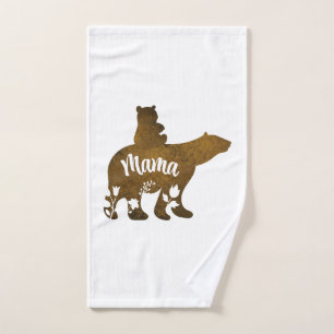 Mamá oso con 1 cachorro a la espalda de mamá