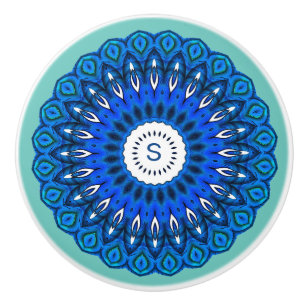 Mandala azul sobre turquesa con el pomo de la caje