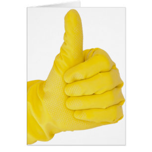 Mano en guante de látex amarillo