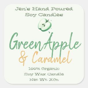 Mano verde de manzana con etiquetas con velas de m