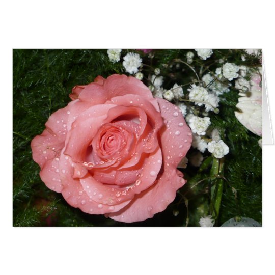Manojo de flores con la tarjeta color de rosa
