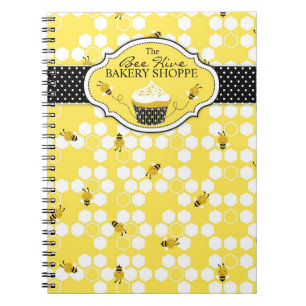 Manosee el cuaderno del negocio de la abeja