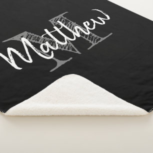 Manta de sherpa de felpa negra grande con monogram