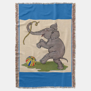 Manta elefante feliz jugando con cuerda y bola