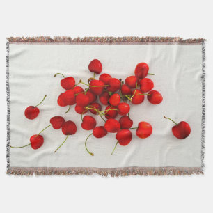 Manta Las cerezas rojas con luz natural yacen en blanco