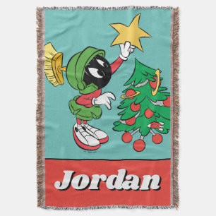 Manta MARVIN THE MARTIAN™ poniendo estrella en el árb