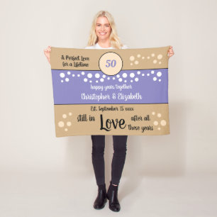 Manta Polar 50 Aniversario morado y oro aún enamorado