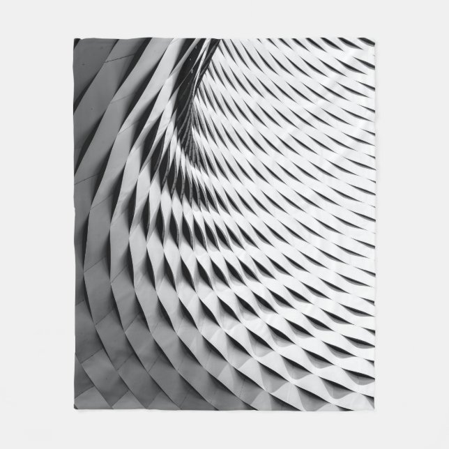 Manta Polar A curved facade covered in white latticework (Anverso)