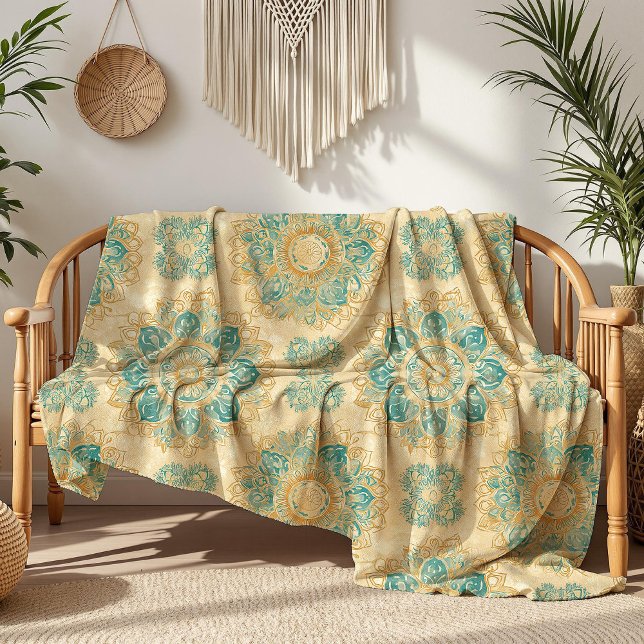 Manta Polar Boho Turquesa y Beige Arena Mandala (Boho Turquoise and Sand Beige Mandala Fleece Blanket on a boho rattan sofa nex to house plants)