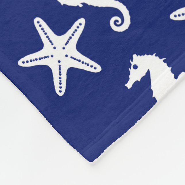 Manta Polar Caballo de mar y pez estrella - azul marino y blan (Esquina)