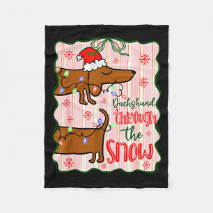 Manta Polar Coquette Dachshund a través de la nieve, camisetas