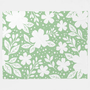 Manta Polar Diseño floral blanco sobre fondo verde suave