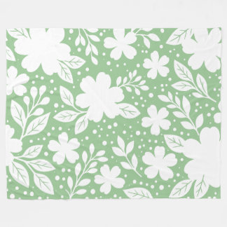 Manta Polar Diseño floral blanco sobre fondo verde suave
