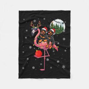 Manta Polar Dos rottweilers navideños montando reno flamenco