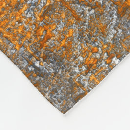 Manta Polar Flecto con un naranja dorado sobre crudo gris blan