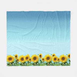 Manta Polar Girasoles elegantes sobre tonos azul cielo