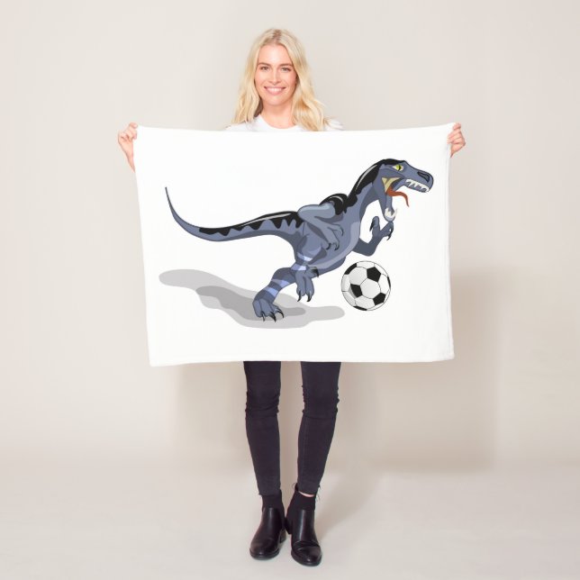 Manta Polar Ilustracion De Un Dinosaurio Raptor Jugando Fútbol (In situ)