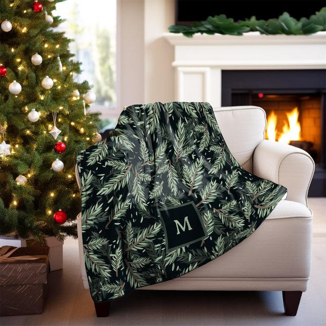 Manta Polar Navidades elegantes se ramifican en negro con mono (A stylish holiday blanket with Christmas pine branches and your monogram, on a dark background)