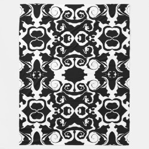 Manta Polar Patrón giratorio en blanco y negro