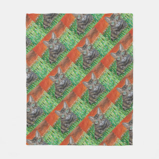 Manta Polar Tabby cat looking curious in grass fleece blanket 