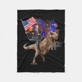 Manta Polar Trump montando un dinosaurio en T-rex apoya a Trum
