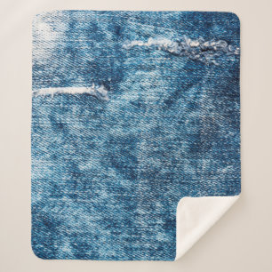 Manta Sherpa Denim textura.Jean azules con hilos y agujeros de