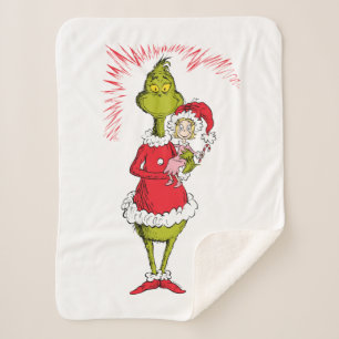 Manta Sherpa El Grinch abraza a Cindy Lou Who