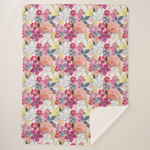 Manta Sherpa Flores color de agua rosada y roja.