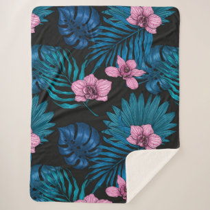 Manta Sherpa Orquídeas y hojas de palma, rosa y azul en negro