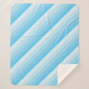 Manta Sherpa Rayas diagonales ombre en tonos de azul turquesa